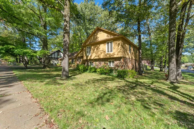 a backyard of a house with lots of green space