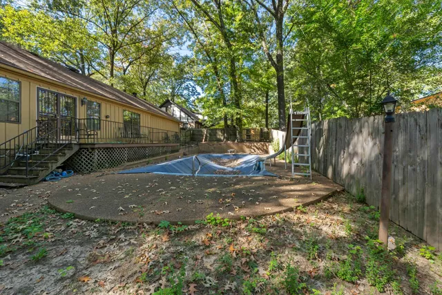a backyard of a house with barbeque oven