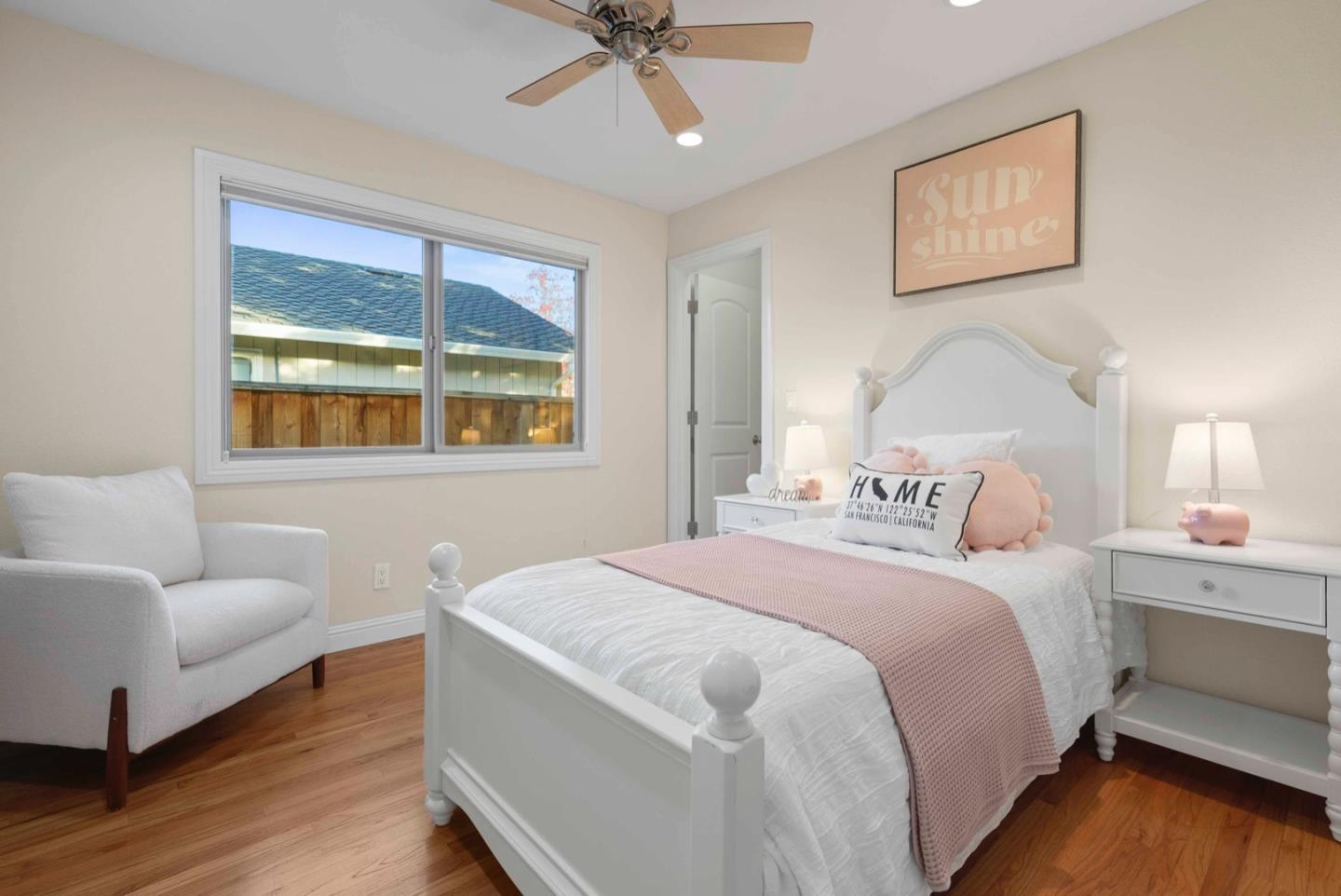 18373 Vanderbilt Drive Saratoga, CA 95070 - Photo 13 of 26 a bedroom with a bed and wooden floor