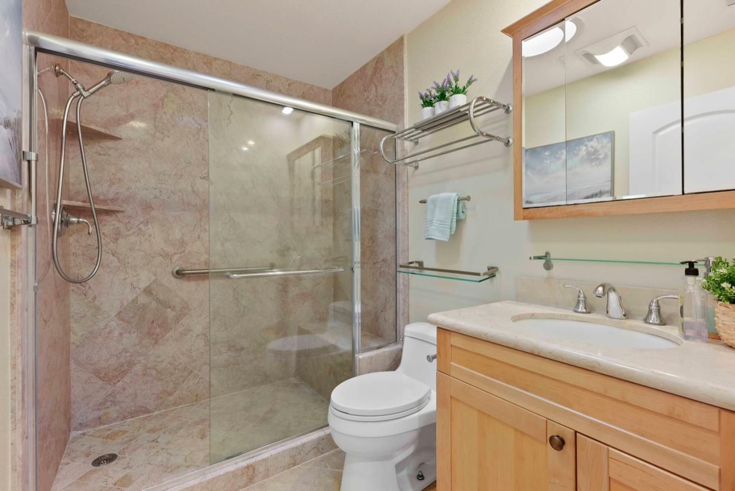 18373 Vanderbilt Drive Saratoga, CA 95070 - Photo 15 of 26 a bathroom with a sink toilet and shower