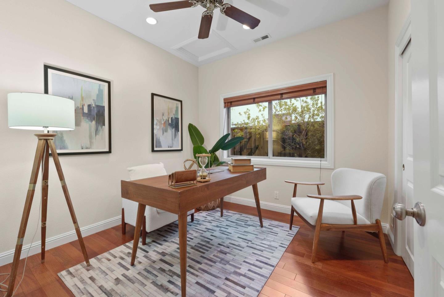18373 Vanderbilt Drive Saratoga, CA 95070 - Photo 16 of 26 a view of a workspace with furniture and a window