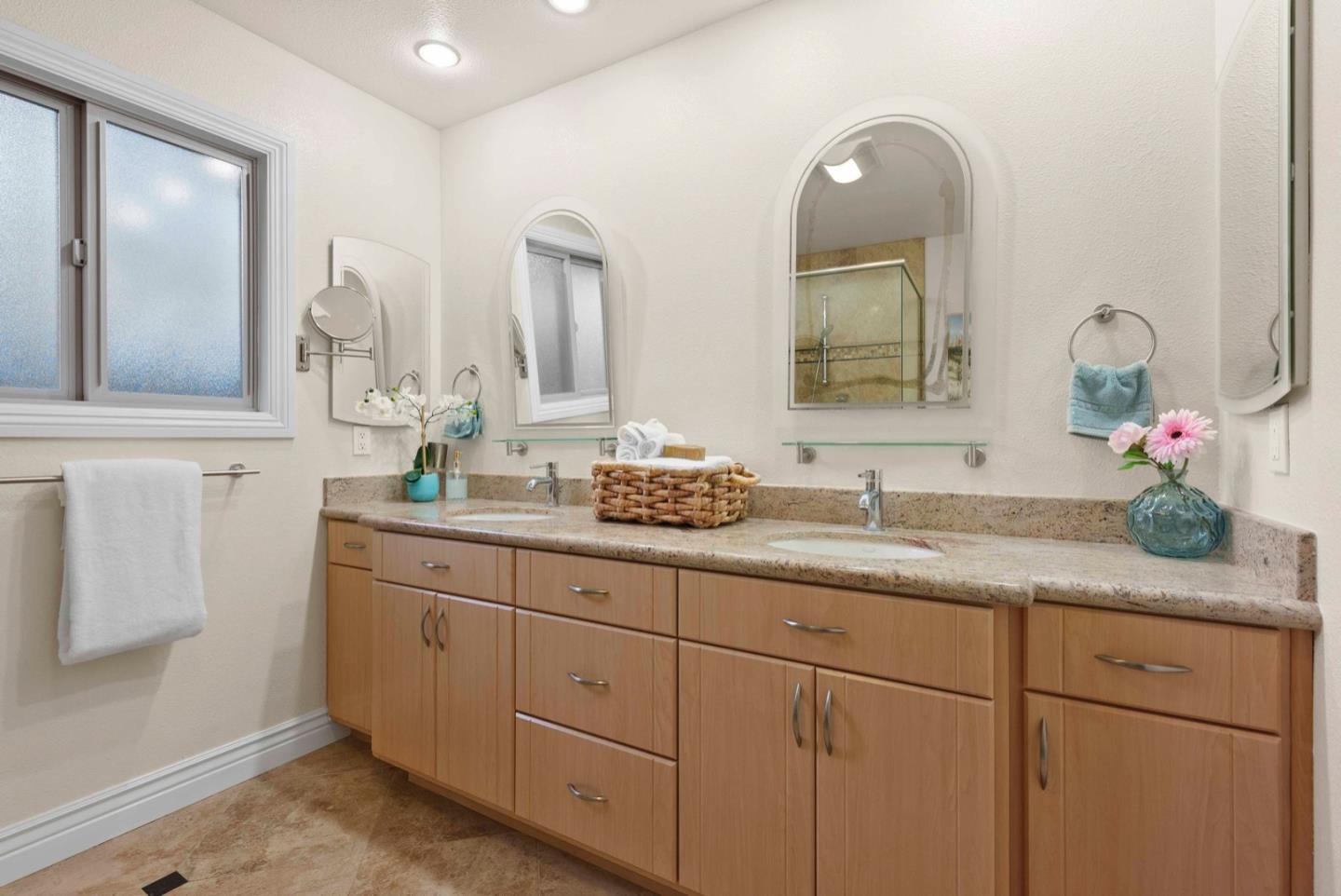 18373 Vanderbilt Drive Saratoga, CA 95070 - Photo 19 of 26 a bathroom with a granite countertop sink mirror and