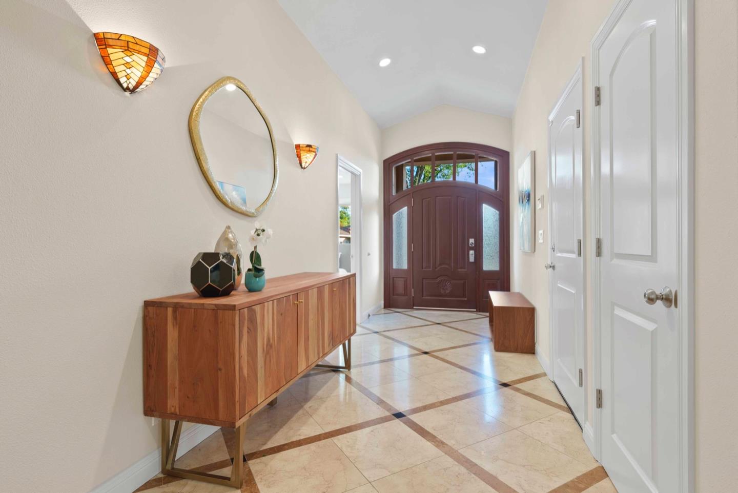 18373 Vanderbilt Drive Saratoga, CA 95070 - Photo 2 of 26 a view of a hallway with entryway wooden floor and front door