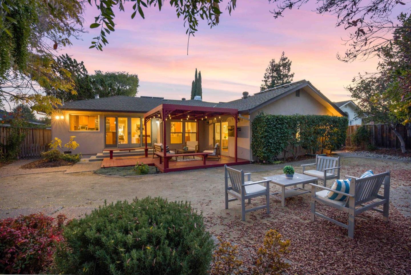18373 Vanderbilt Drive Saratoga, CA 95070 - Photo 23 of 26 a view of a patio with table and chairs potted plants and large tree