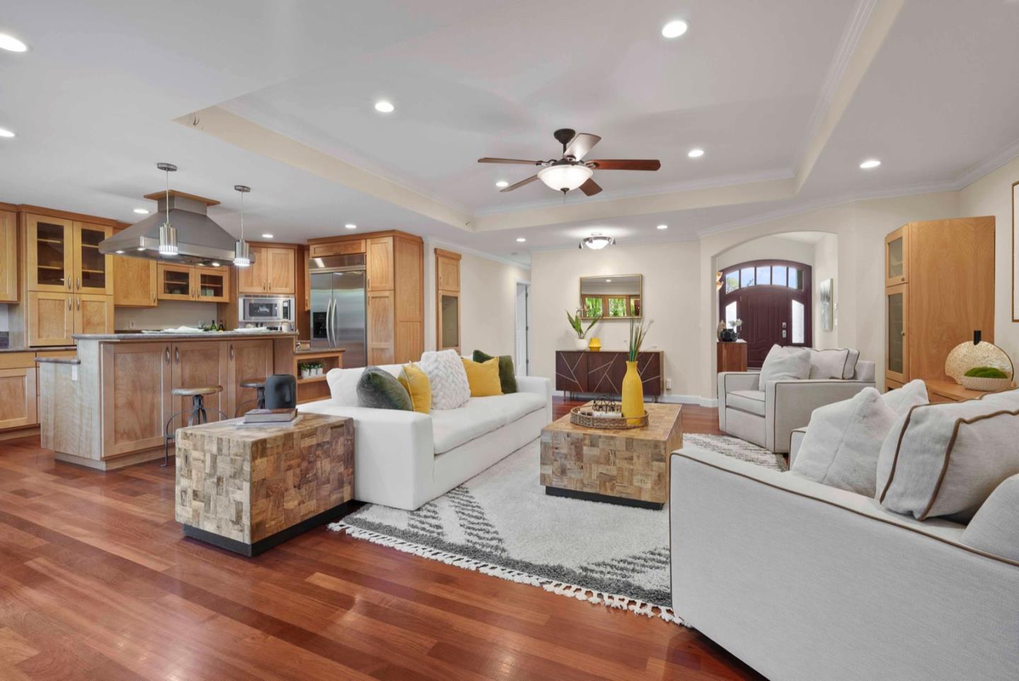 18373 Vanderbilt Drive Saratoga, CA 95070 - Photo 8 of 26 a living room with fireplace furniture and a wooden floor