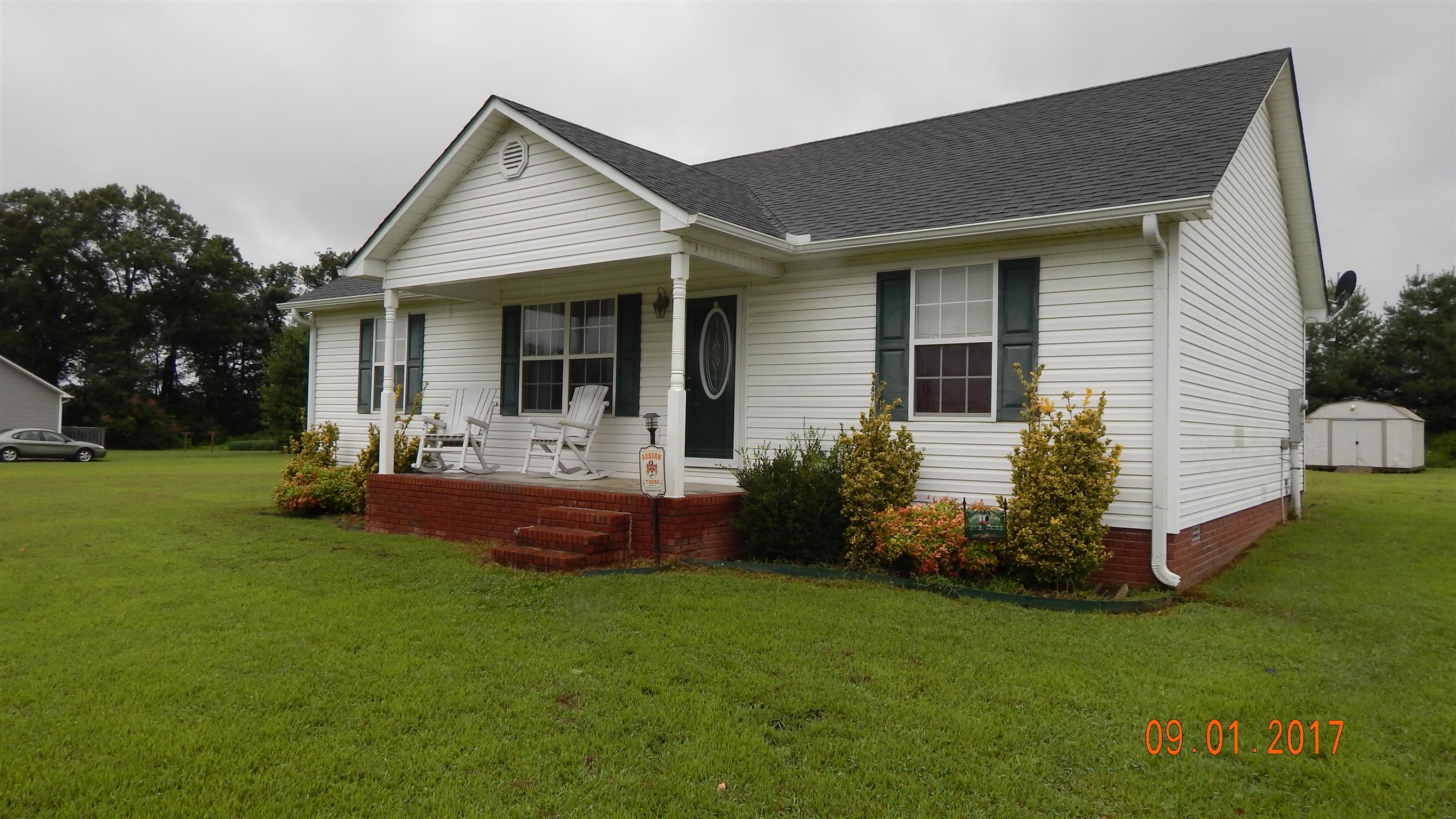 7 Myrick Road Flintville, TN 37335 - Photo 1 of 12 a front view of house with a garden and patio