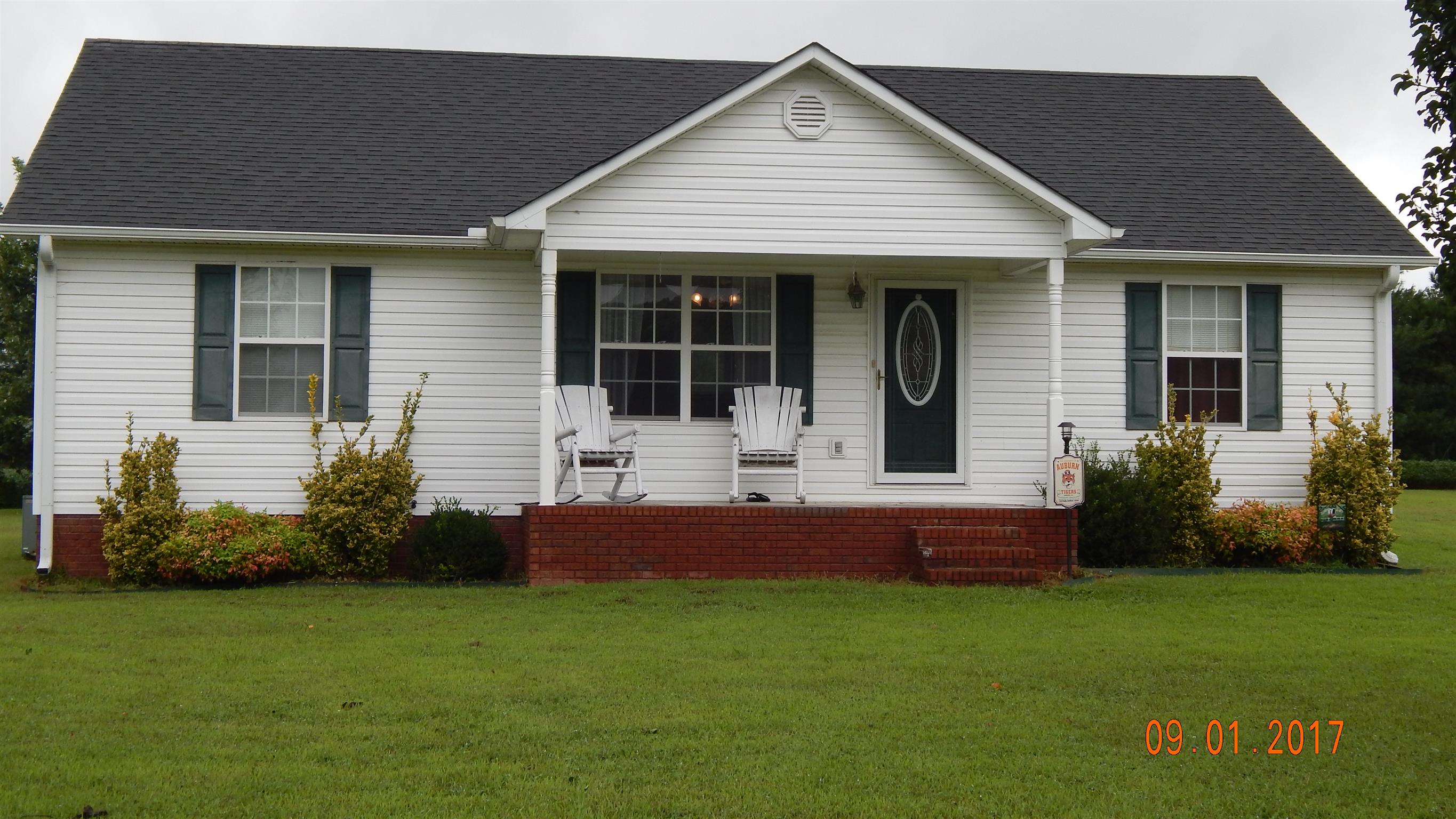 7 Myrick Road Flintville, TN 37335 - Photo 12 of 12 a front view of a house with a garden