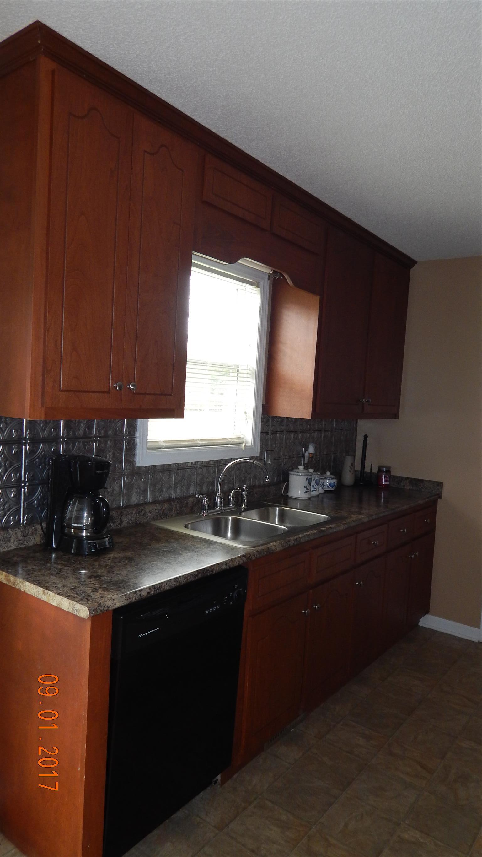 7 Myrick Road Flintville, TN 37335 - Photo 4 of 12 a kitchen with sink and cabinets