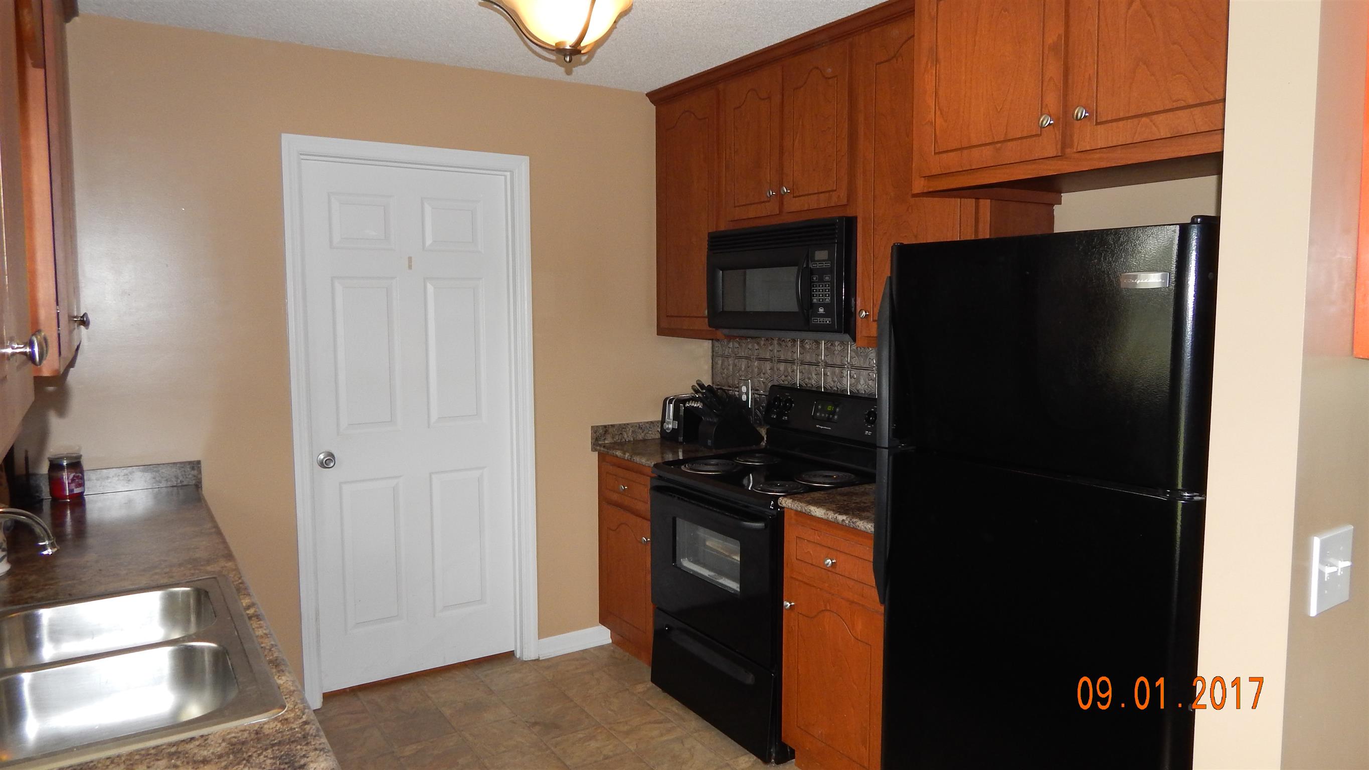 7 Myrick Road Flintville, TN 37335 - Photo 5 of 12 a kitchen with stainless steel appliances granite countertop a refrigerator and a stove top oven