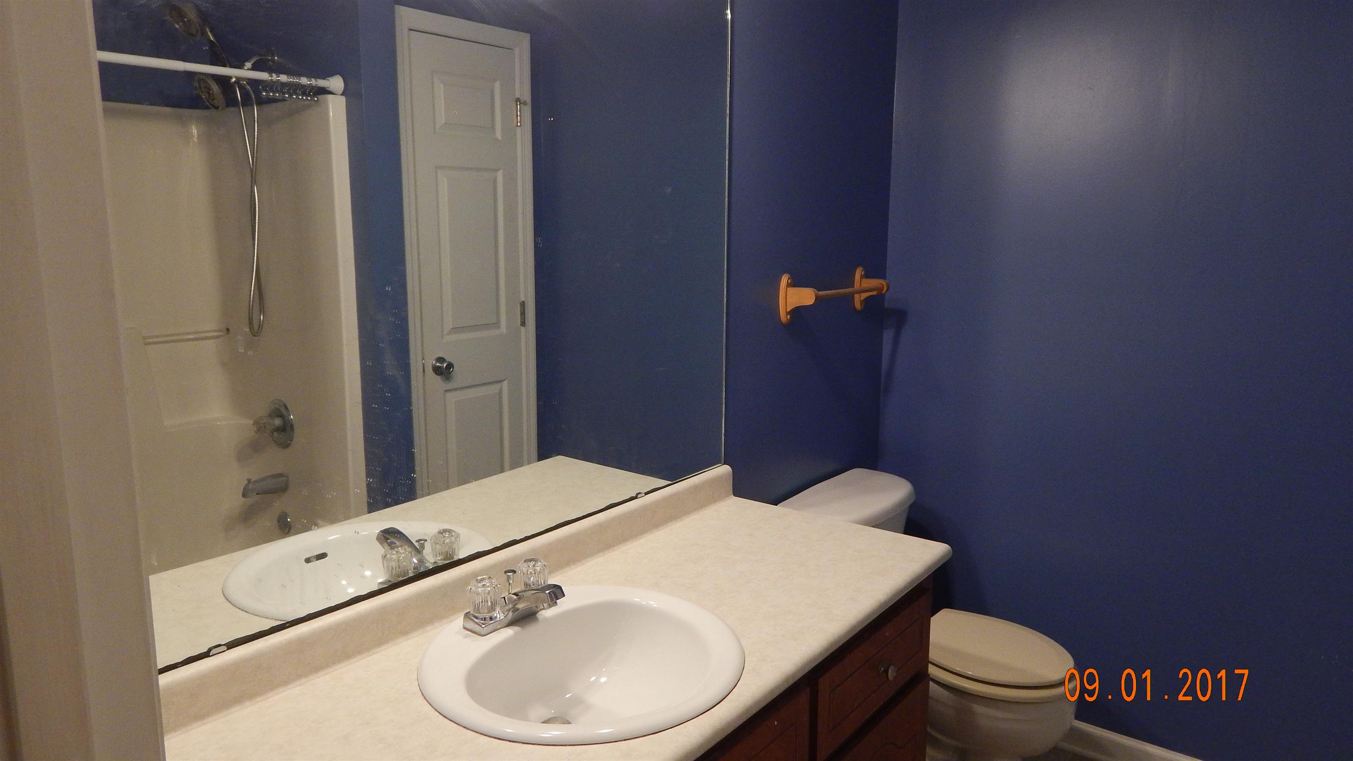 7 Myrick Road Flintville, TN 37335 - Photo 8 of 12 a bathroom with a toilet sink and mirror