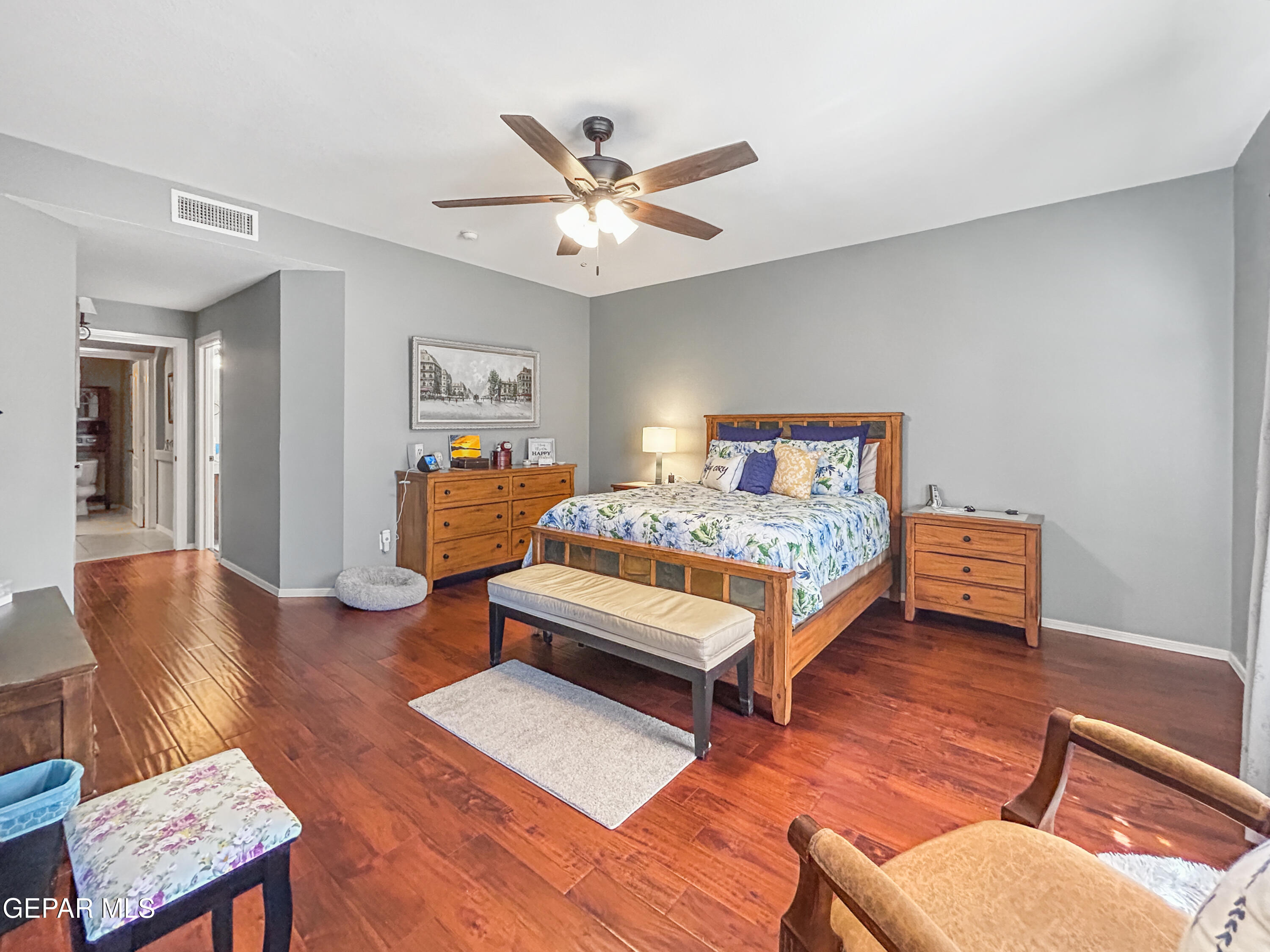 6680 Capitan Ridge El Paso, TX 79912 - Photo 24 of 47 a bedroom with furniture and wooden floor