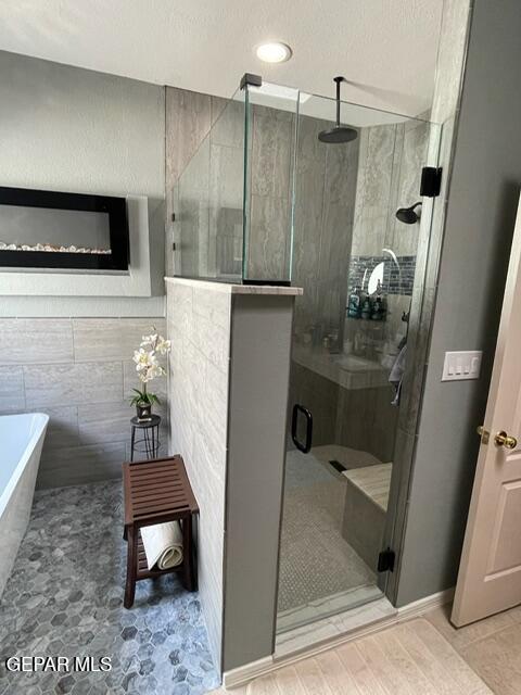 6680 Capitan Ridge El Paso, TX 79912 - Photo 28 of 47 a bathroom with a shower and a sink