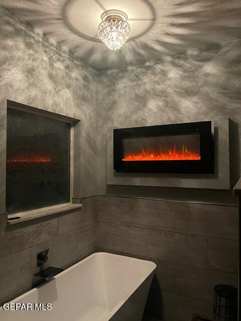 6680 Capitan Ridge El Paso, TX 79912 - Photo 30 of 47 a bathroom with a sink and a fireplace