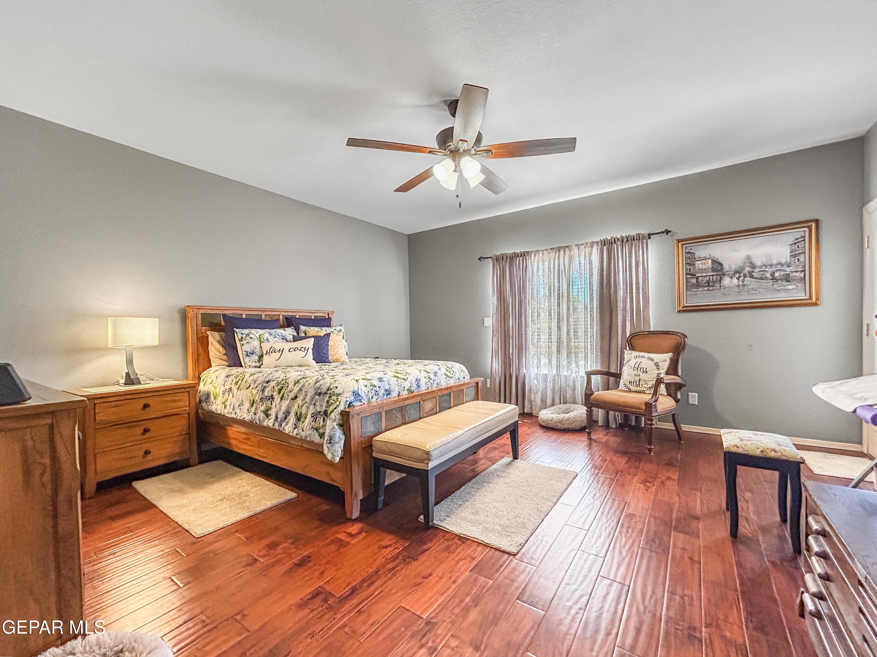 6680 Capitan Ridge El Paso, TX 79912 - Photo 3 of 47 a bedroom with a bed and wooden floor