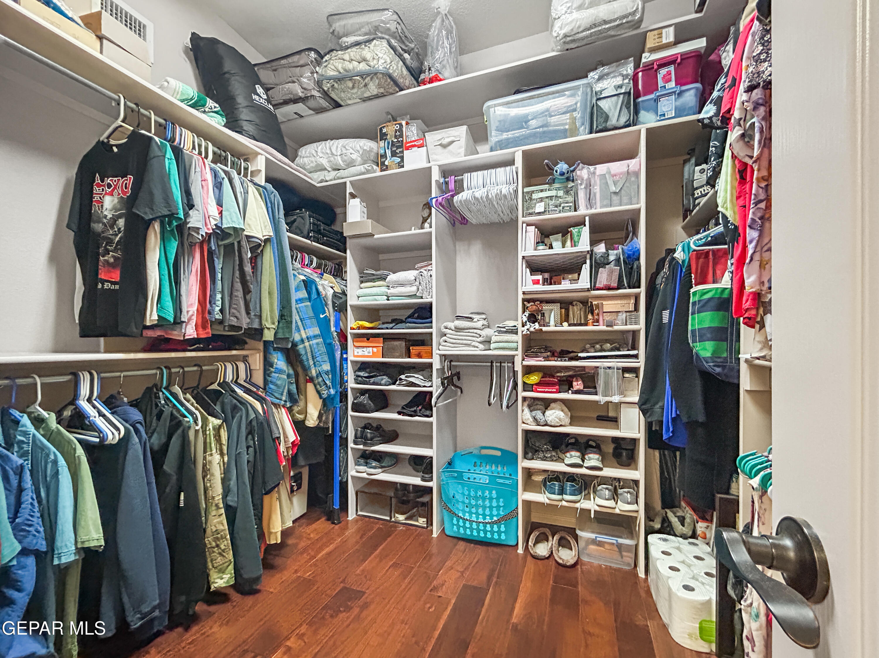 6680 Capitan Ridge El Paso, TX 79912 - Photo 31 of 47 a view of walk in closet with clothes and shoes