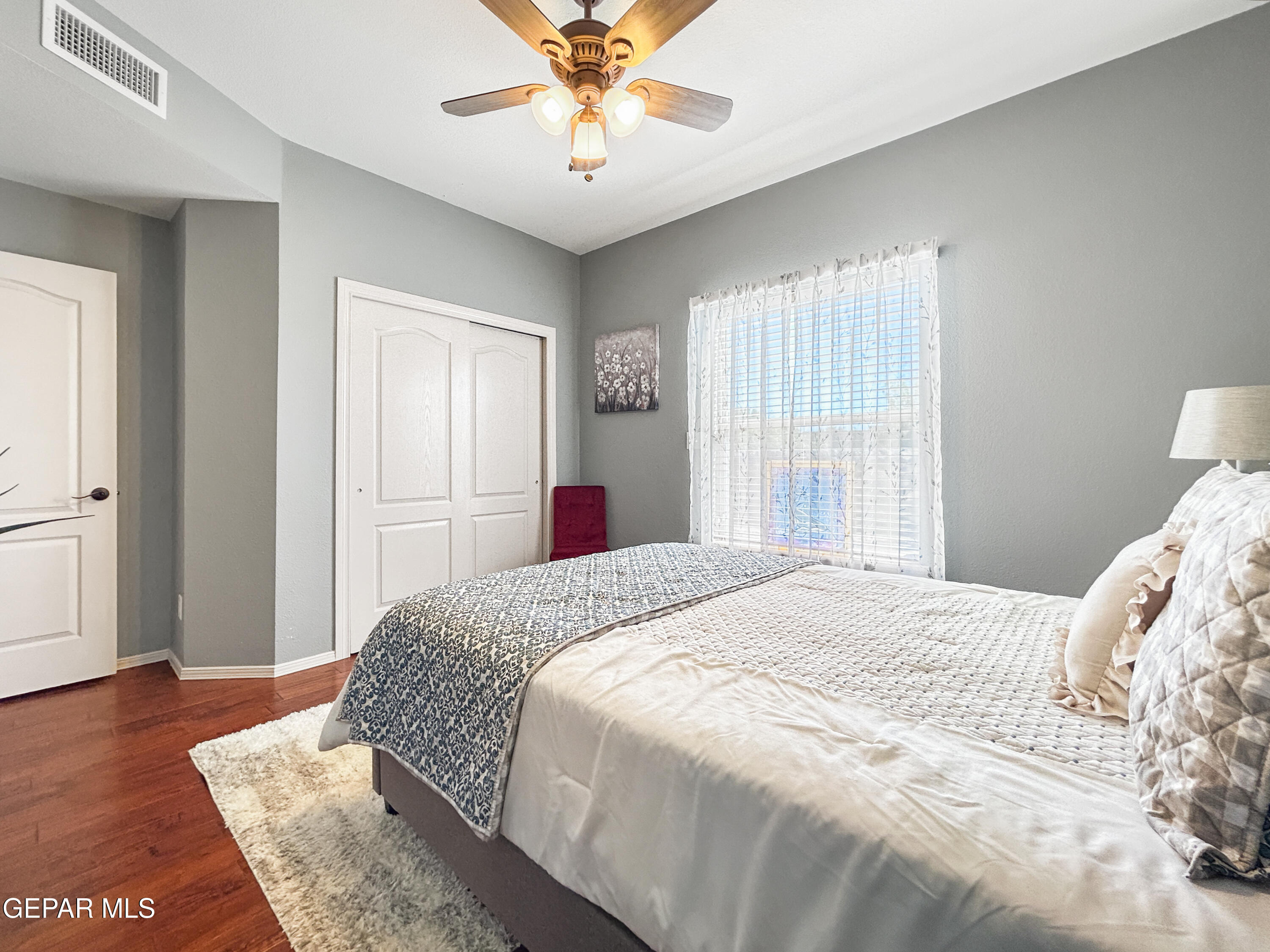 6680 Capitan Ridge El Paso, TX 79912 - Photo 36 of 47 a bedroom with a large bed and a chandelier