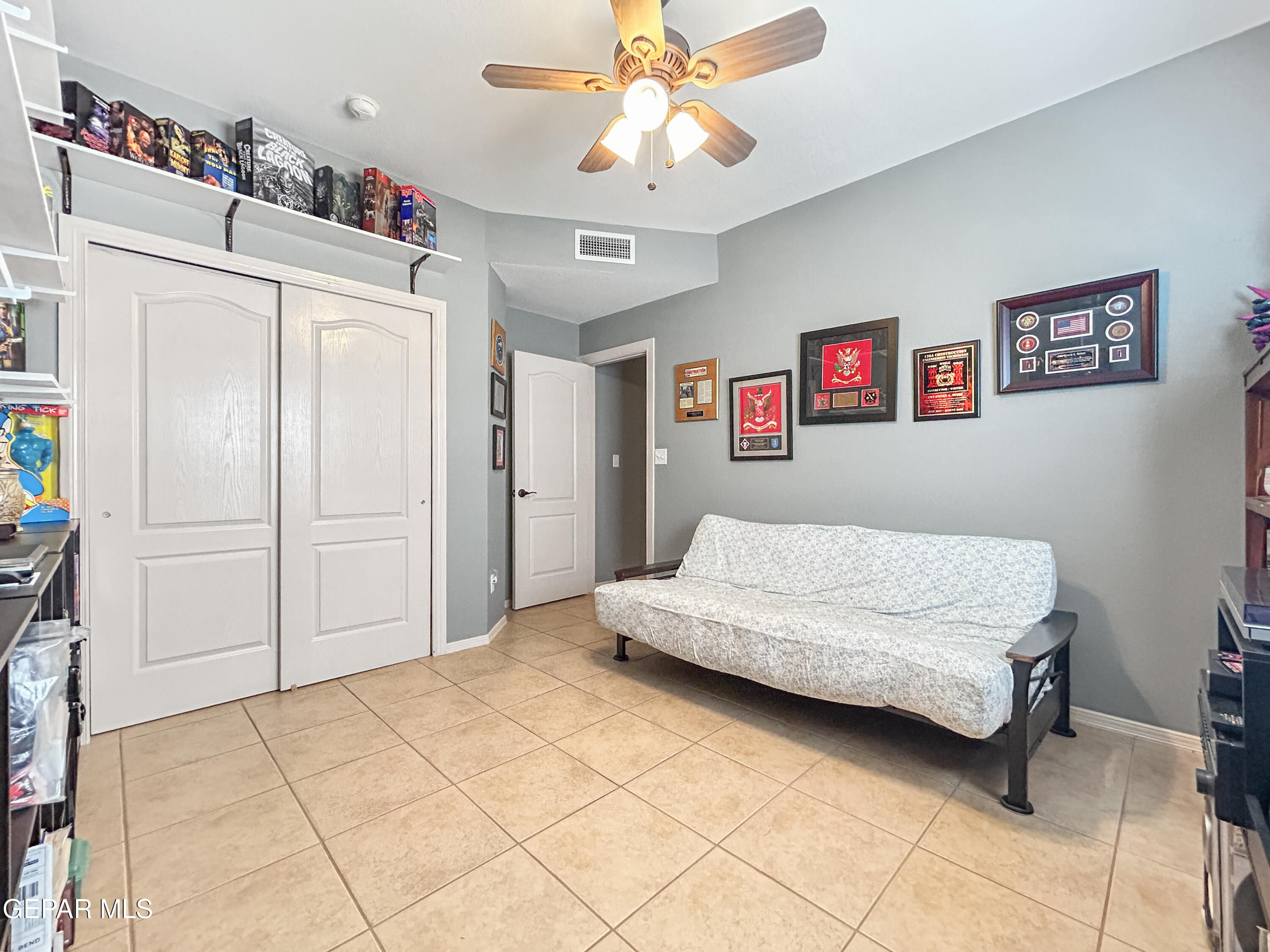 6680 Capitan Ridge El Paso, TX 79912 - Photo 40 of 47 a bedroom with a bed and a chandelier