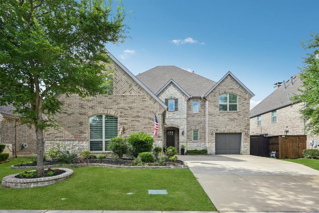 2029 Temperate Drive Allen, TX 75013 - Photo 1 of 40 a front view of a house with a yard and garage