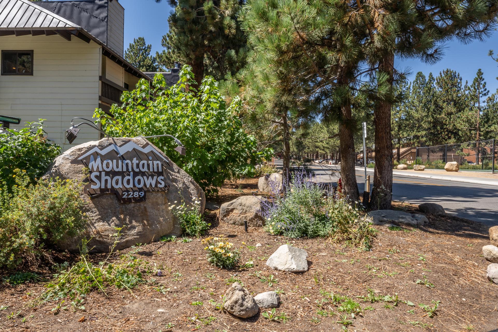 2289 Sierra Nevada Road, Unit F11 Mammoth Lakes, CA 93546 - Photo 16 of 17 a front view of a house with a yard