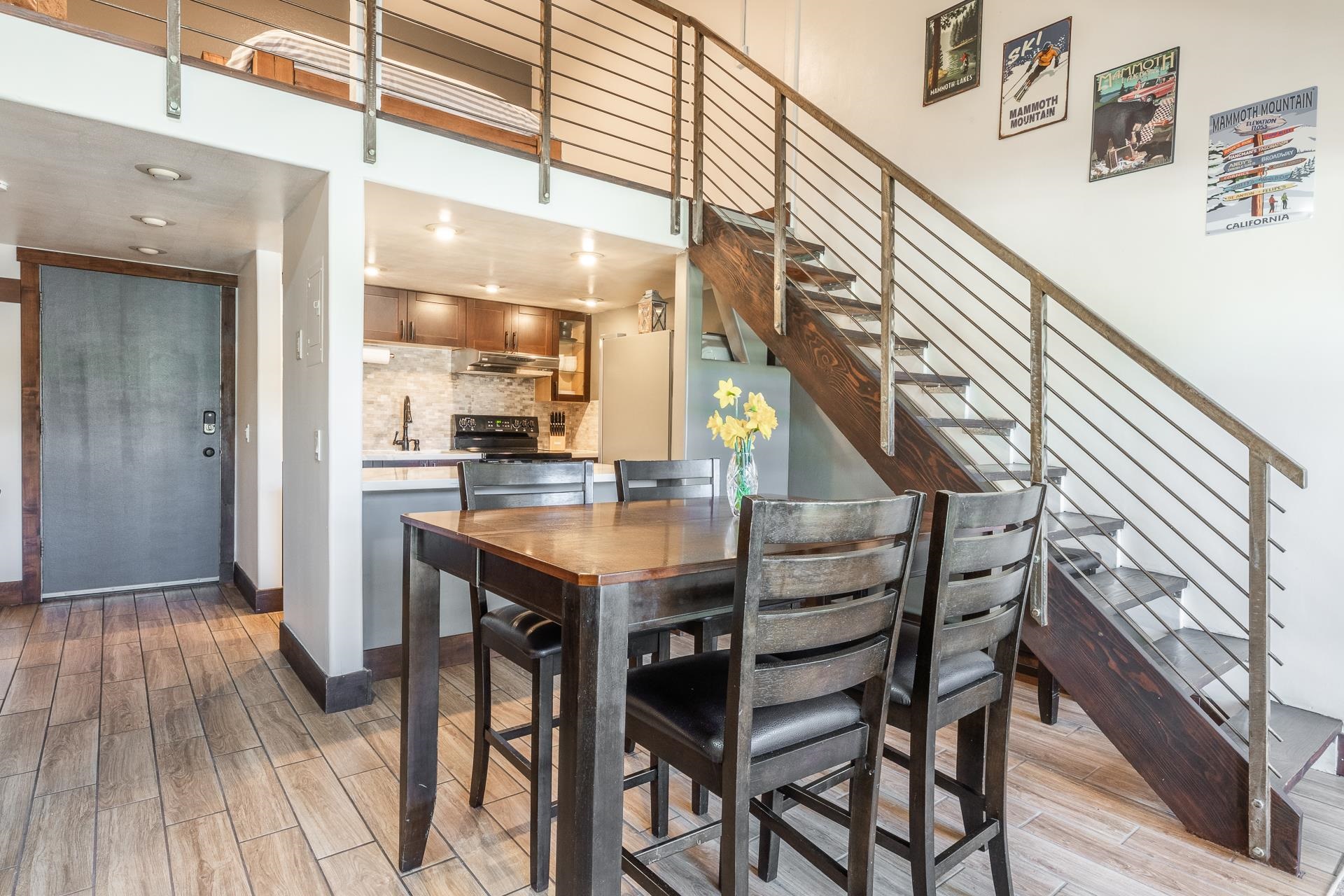 2289 Sierra Nevada Road, Unit F11 Mammoth Lakes, CA 93546 - Photo 2 of 17 a kitchen with a table and chairs