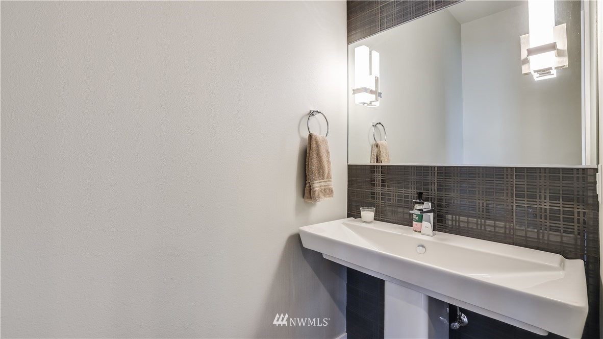 928 North 34th Street Renton, WA 98056 - Photo 14 of 29 a bathroom with a sink and a mirror