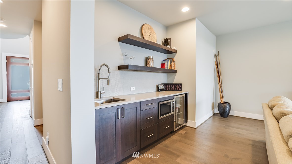 928 North 34th Street Renton, WA 98056 - Photo 22 of 29 a kitchen with stainless steel appliances a sink and a stove top oven