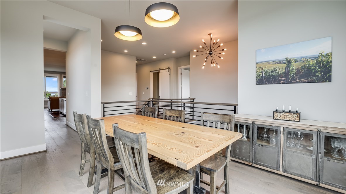 928 North 34th Street Renton, WA 98056 - Photo 8 of 29 a view of a dining room with furniture and a chandelier