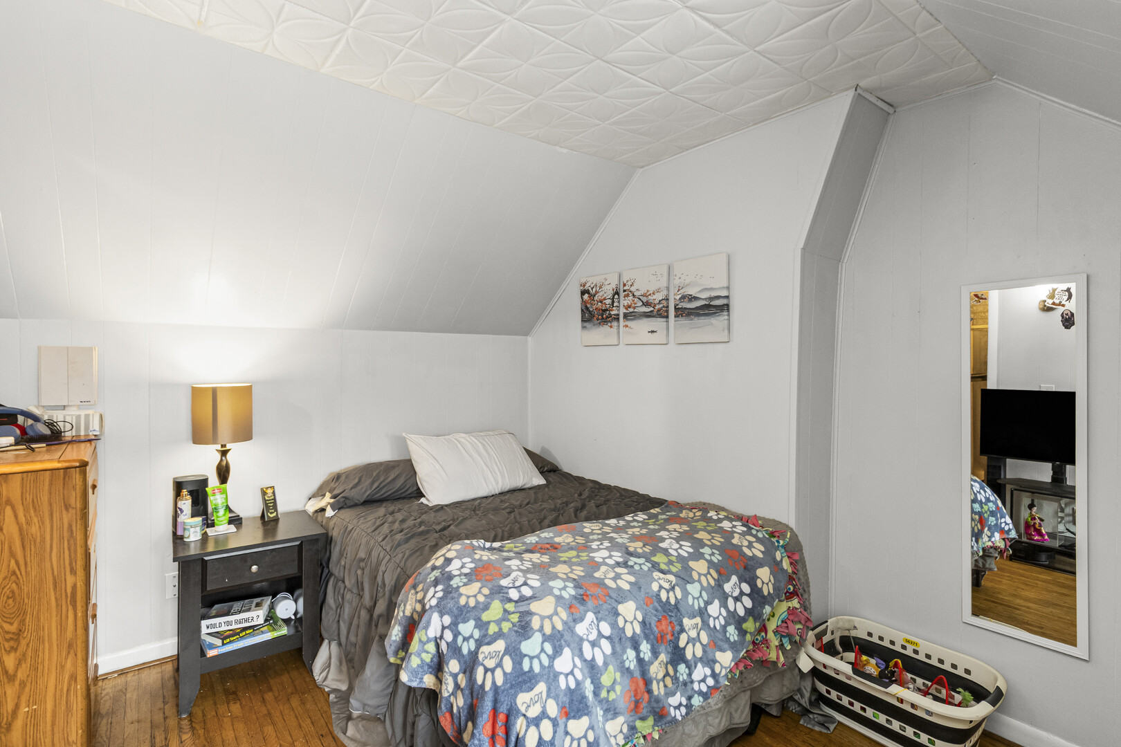 102 South Liberty Street, Unit 3 Elgin, IL 60120 - Photo 12 of 18 a bedroom with a bed and a flat screen tv