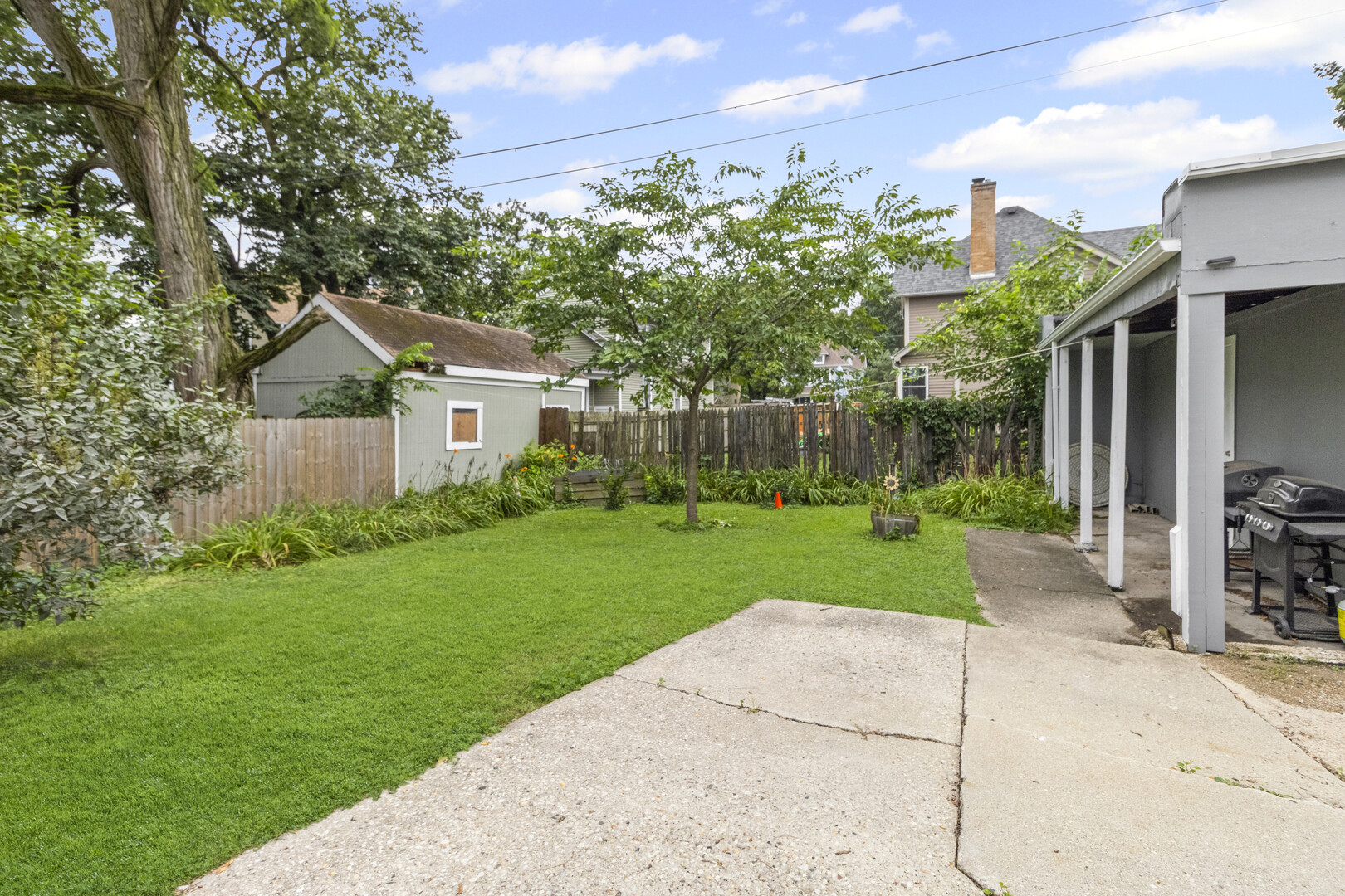 102 South Liberty Street, Unit 3 Elgin, IL 60120 - Photo 13 of 18 a view of a house with a yard and pathway