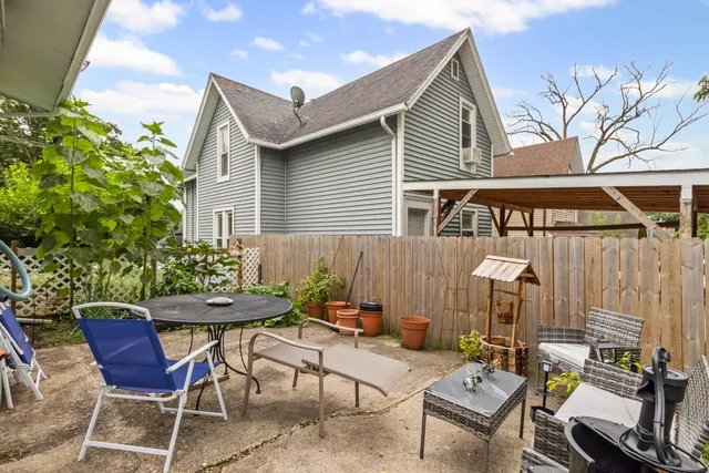 a view of a chairs and table in a patio