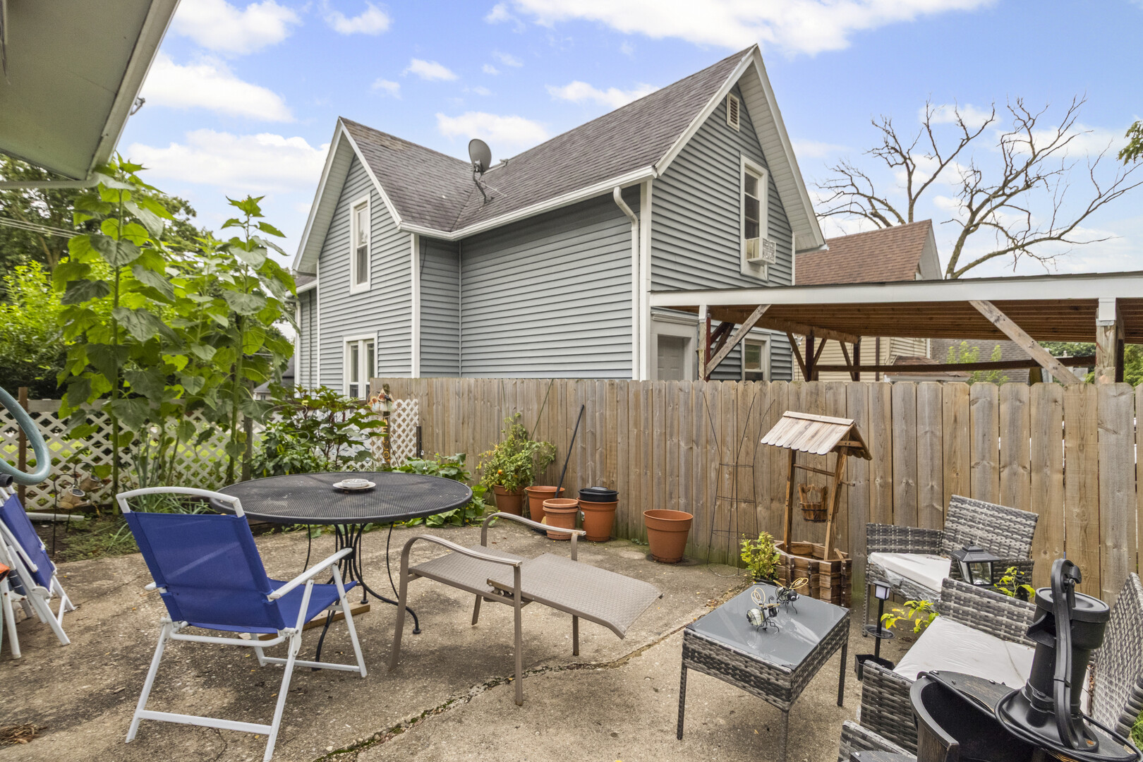 102 South Liberty Street, Unit 3 Elgin, IL 60120 - Photo 14 of 18 a view of a chairs and table in a patio