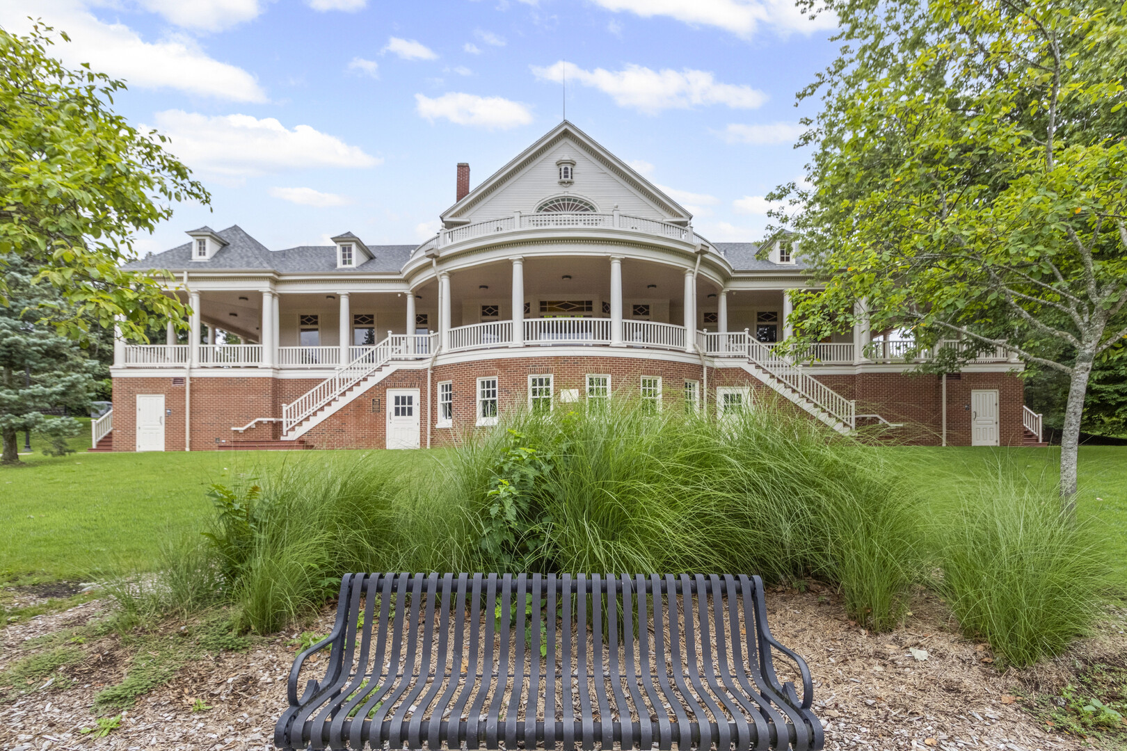 102 South Liberty Street, Unit 3 Elgin, IL 60120 - Photo 18 of 18 a front view of a house with a yard table and chairs