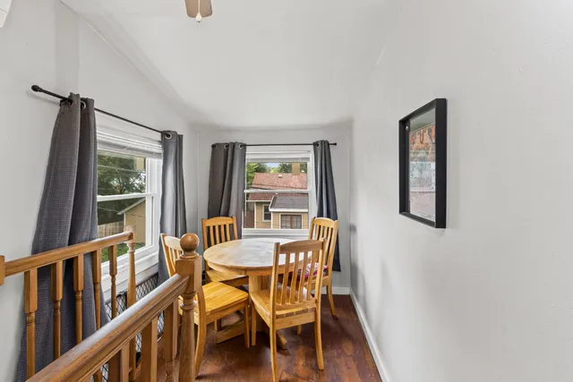 a dining room with furniture and window
