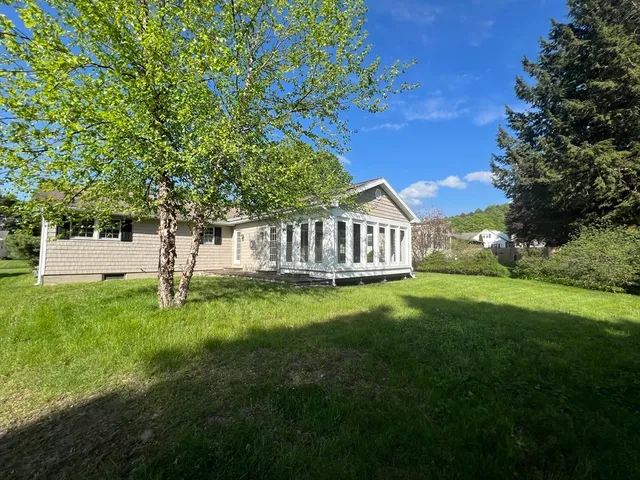a view of a house with a yard