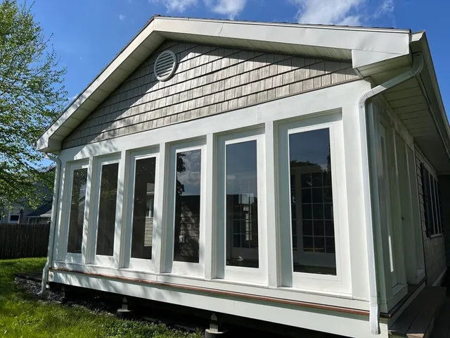 a view of a house with a small yard