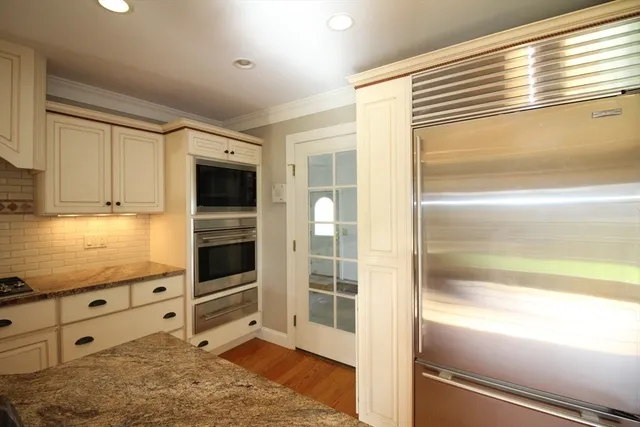 a view of a kitchen with an oven and cabinets