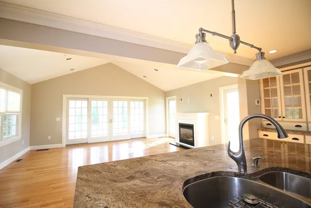 a kitchen with a faucet a sink and a window