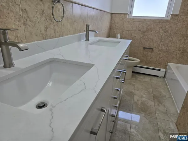 a bathroom with a sink and mirror