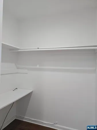 a view of an empty walk in closet