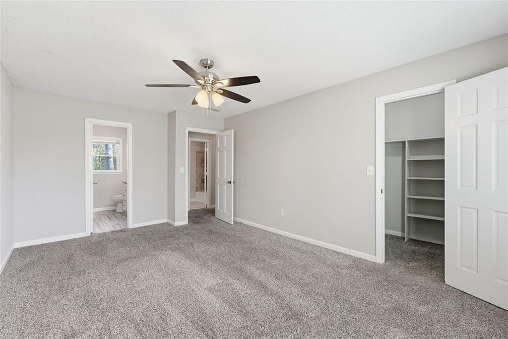 2328 Horseshoe Bend Road Southwest Marietta, GA 30064 - Photo 20 of 44 a view of a big room with closet and a ceiling fan