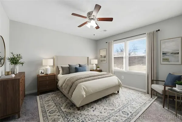a bedroom with a large bed and a window