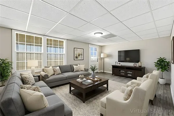 a living room with furniture and a flat screen tv