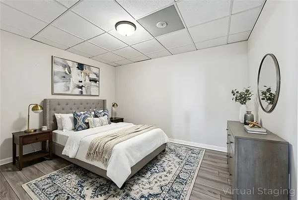 a bedroom with a large bed and a table