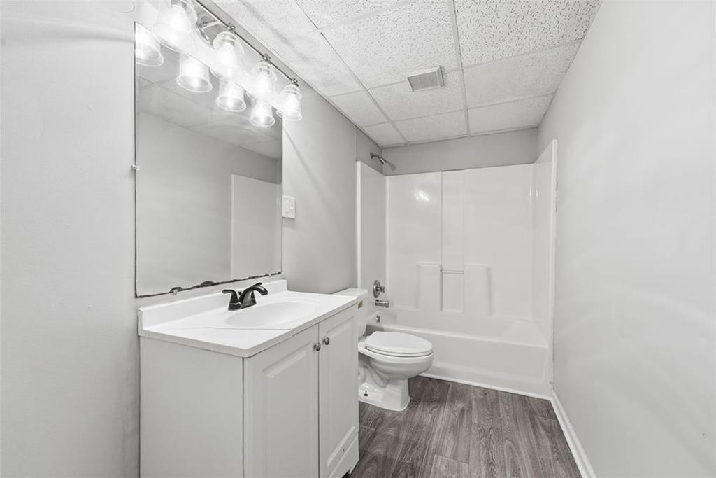 2328 Horseshoe Bend Road Southwest Marietta, GA 30064 - Photo 38 of 44 a bathroom with a sink a toilet and shower