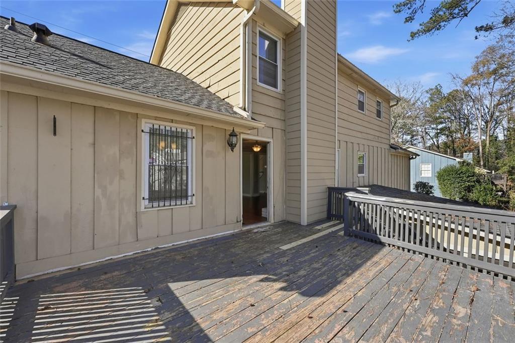 2328 Horseshoe Bend Road Southwest Marietta, GA 30064 - Photo 40 of 44 a view of a house with a deck
