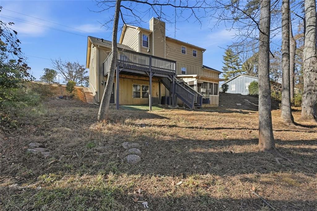 2328 Horseshoe Bend Road Southwest Marietta, GA 30064 - Photo 42 of 44 a view of a house with a yard