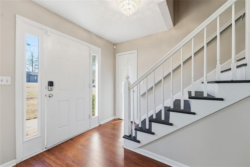 2328 Horseshoe Bend Road Southwest Marietta, GA 30064 - Photo 7 of 44 a view of staircase with wooden floor and entryway