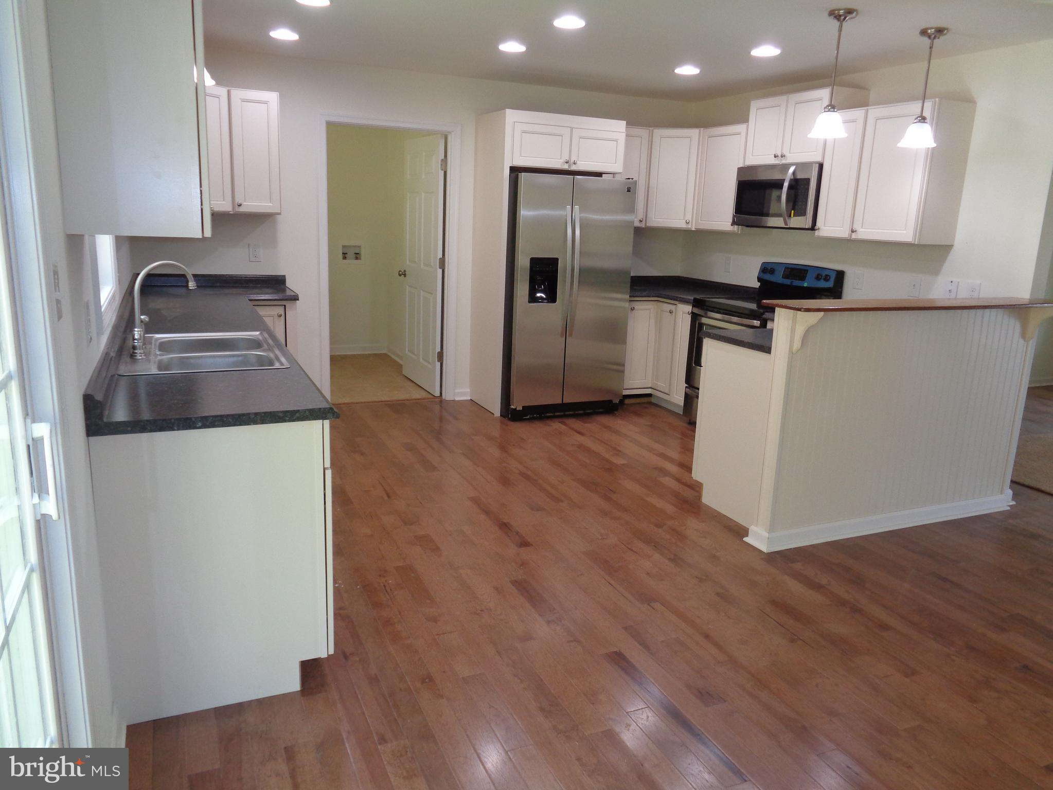 Kitchen with upgraded lighting and appliances