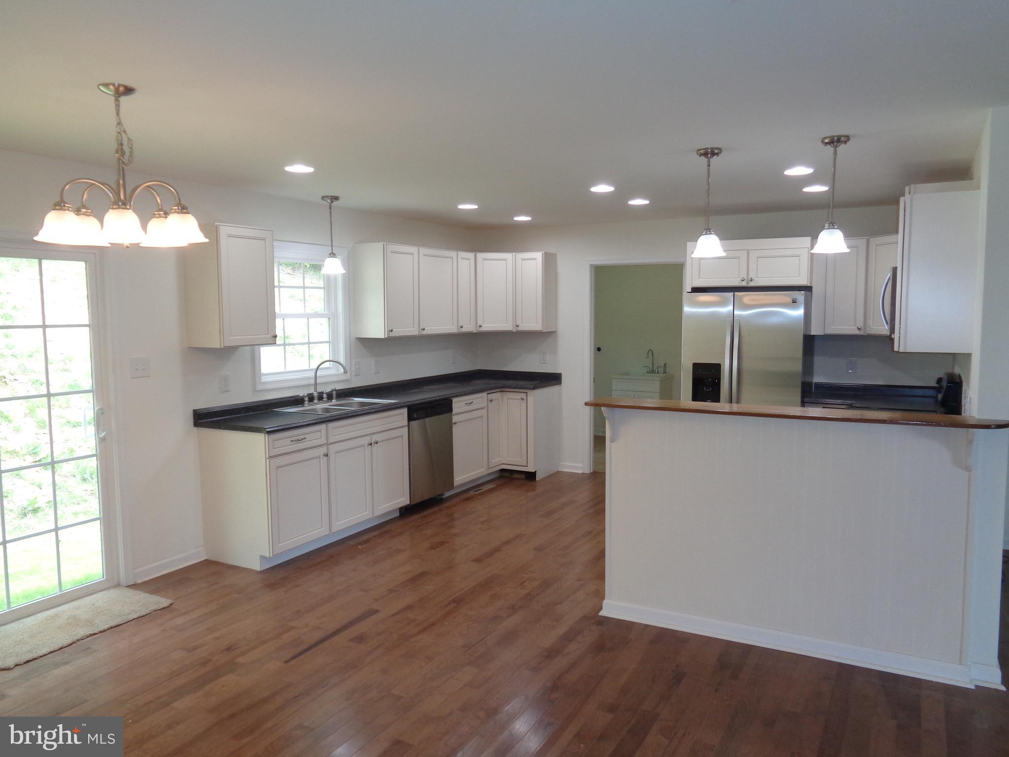 Kitchen with hardwood flooring