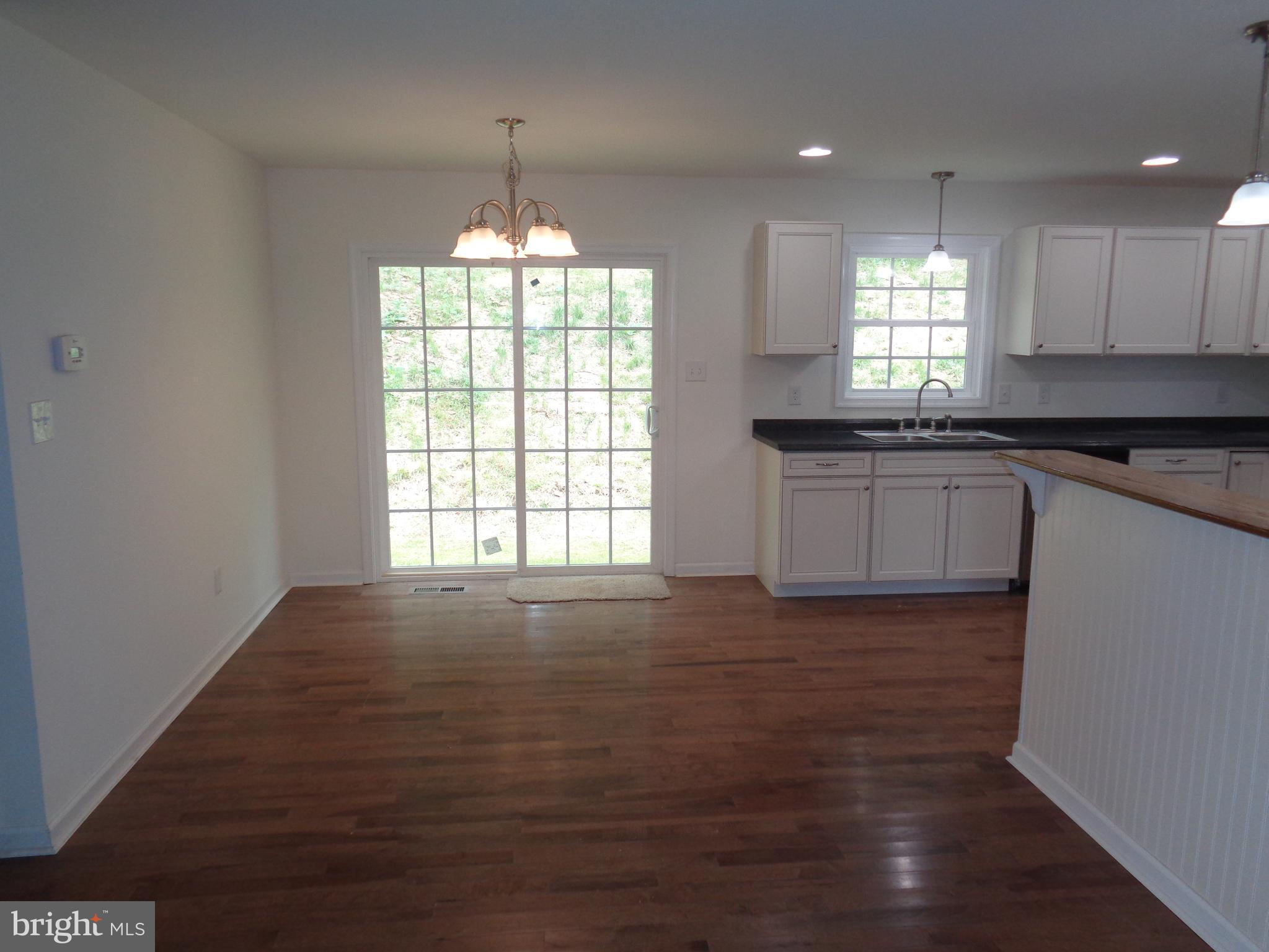 Dining room with hardwood flooring